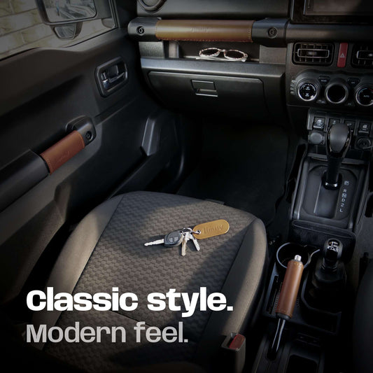 Jimny car interior with keys on the seat, featuring 'Classic style. Modern feel.' leather handle set.